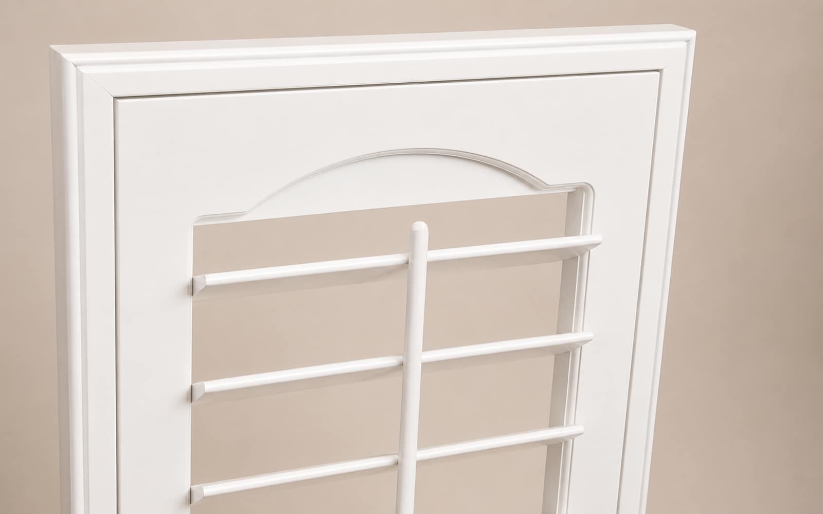 Close-up of a plantation shutter louver with a clean face and no front tilt rod, showing the hidden tilt look